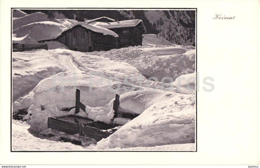 Heimat - snow covered buildings and wooden houses in winter village - Series 2418 - old postcard - Switzerland - unused - JH Postcards